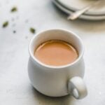Close up of Authentic Pakistani Chai in a white teacup.