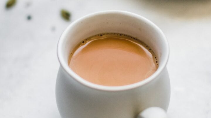 Close up of Authentic Pakistani Chai in a white teacup.