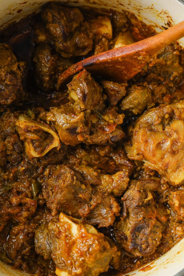 Sautéing mutton once it's cooked (bhunai).