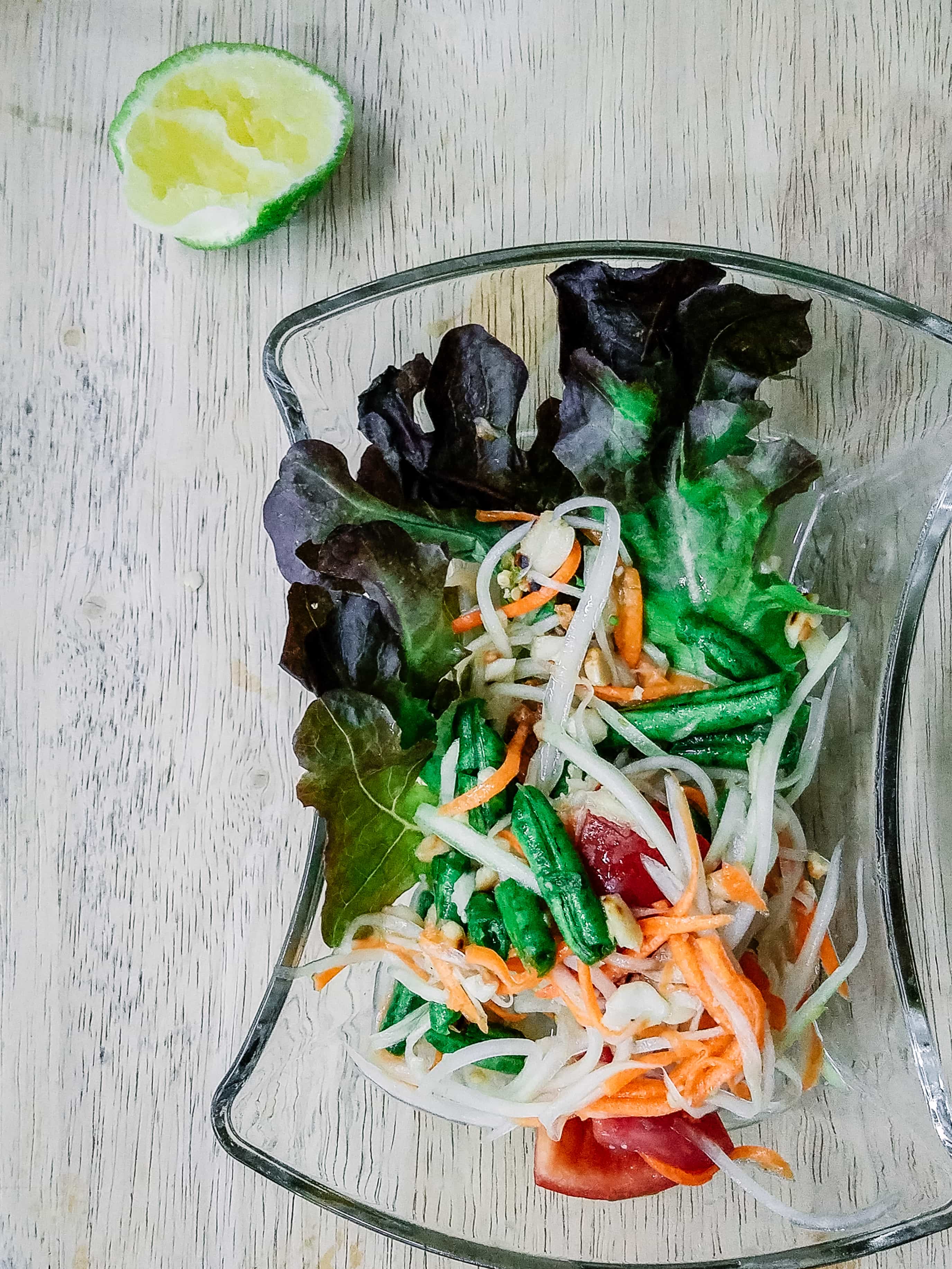 Papaya Salad in a clear glass dish