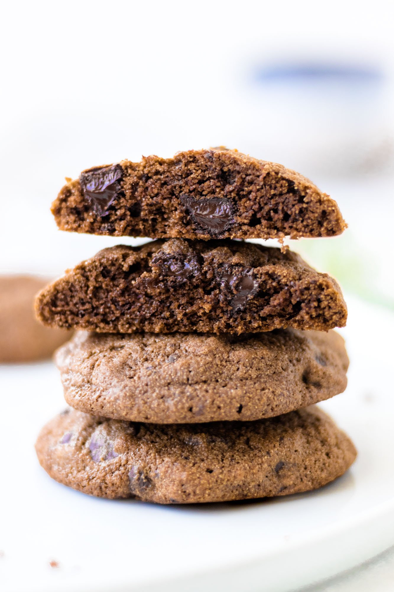 Stack of four Double Chocolate Cardamom Cookies with the top two broken in half.