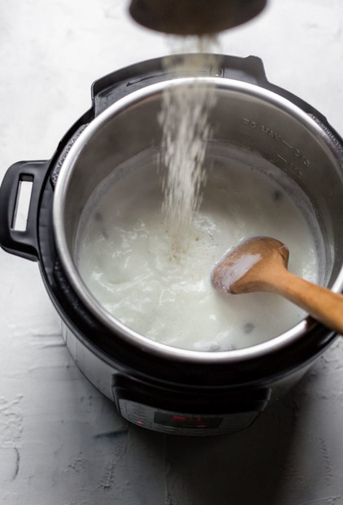 Adding rice to boiling milk and half and half in the Instant Pot