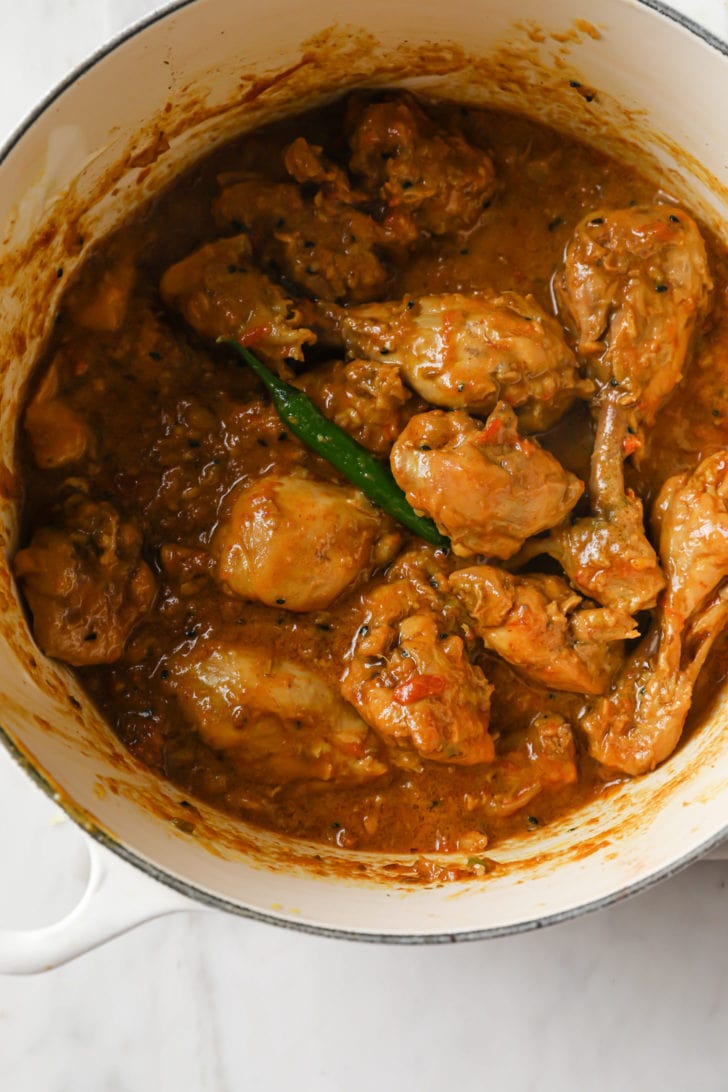 Achari Chicken completely cooked in a dutch oven