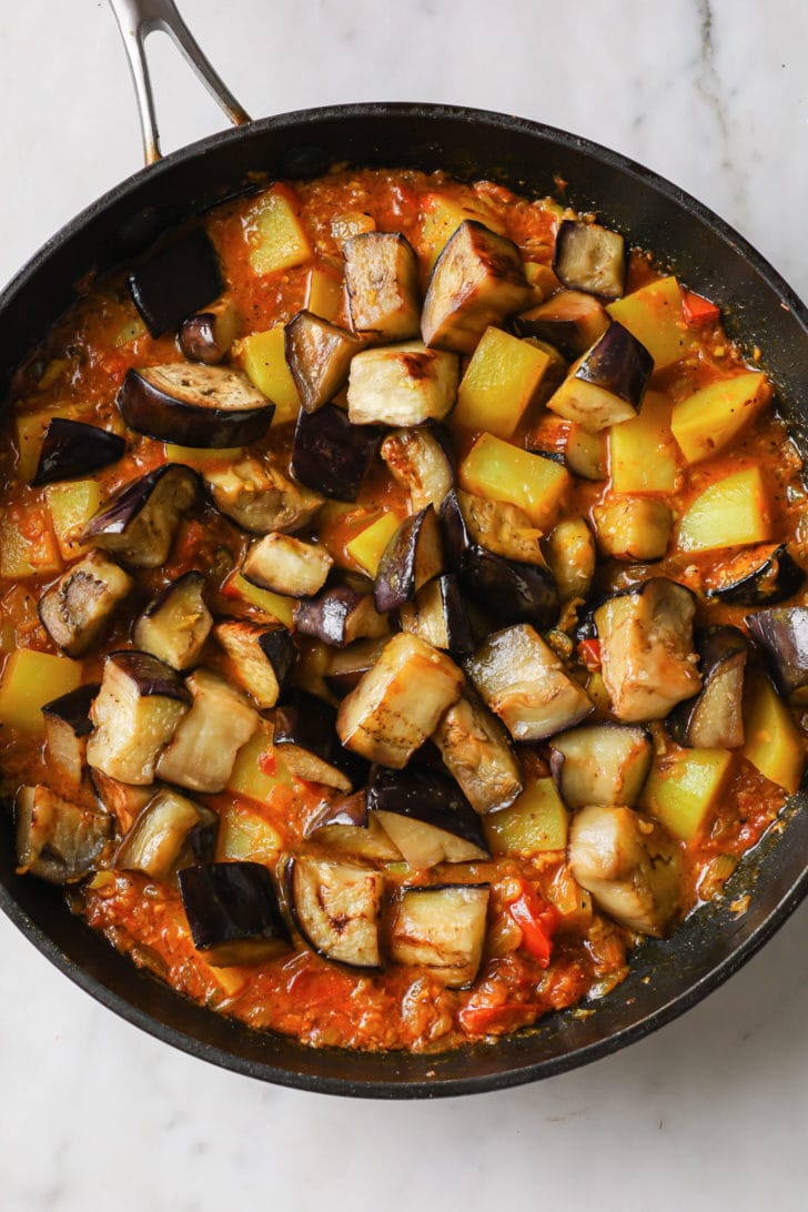 Eggplant and potatoes ready to be cooked in a skillet