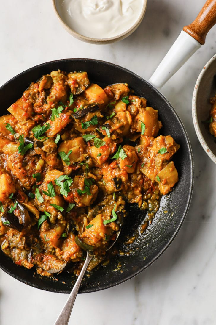 A close up of Eggplant and Potato Curry in a skillet