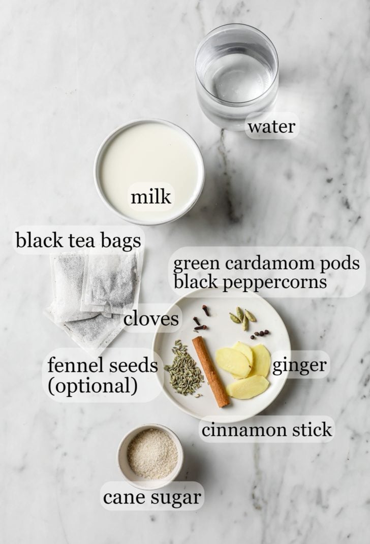 Masala Chai Ingredients such as milk, spices, ginger, and tea bags
