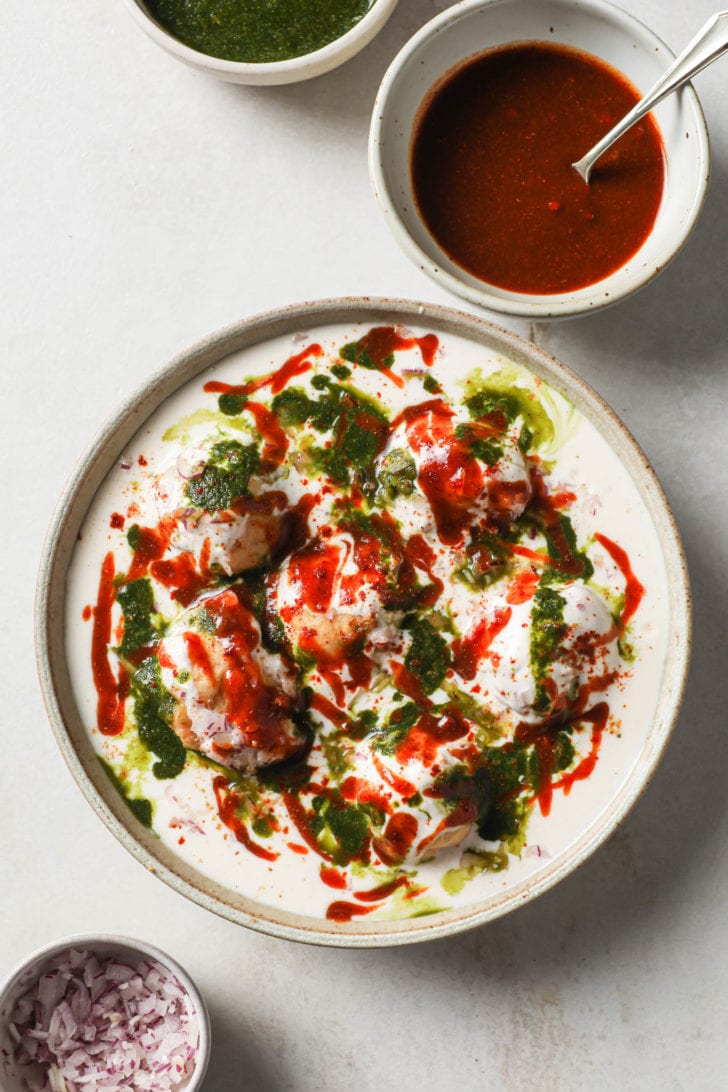 Dahi Bhalla with toppings on the side.