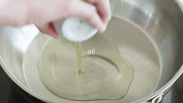 Adding cumin seeds into hot oil