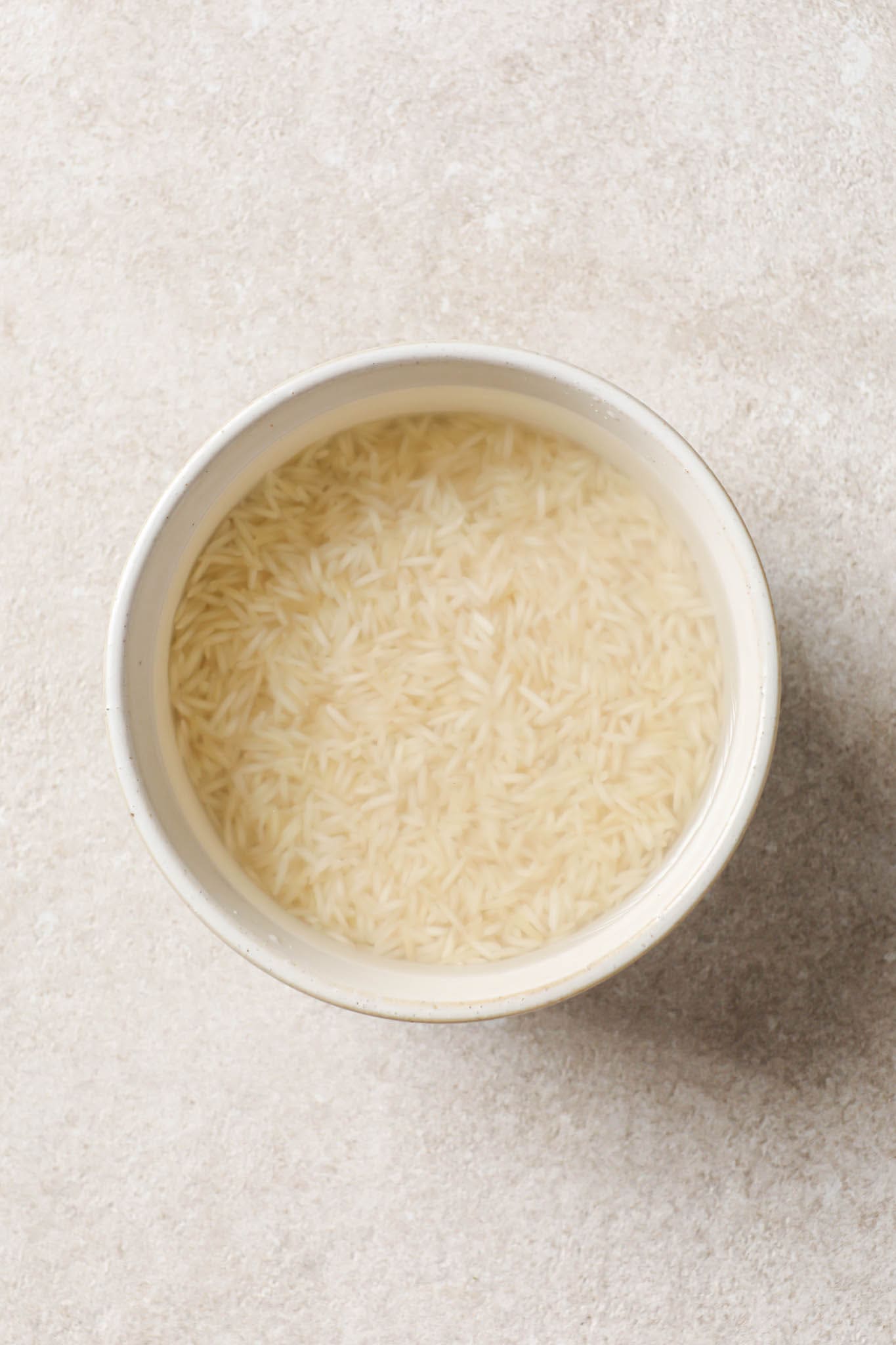 Soaked basmati rice in a bowl