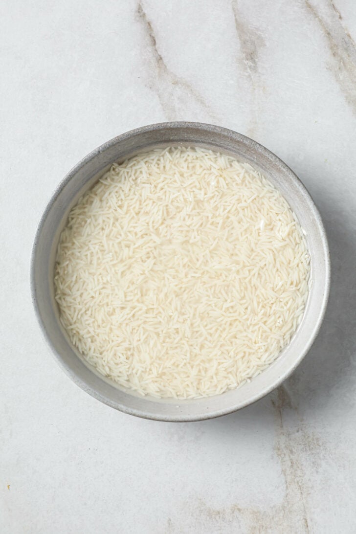 Soaking basmati rice in a bowl.