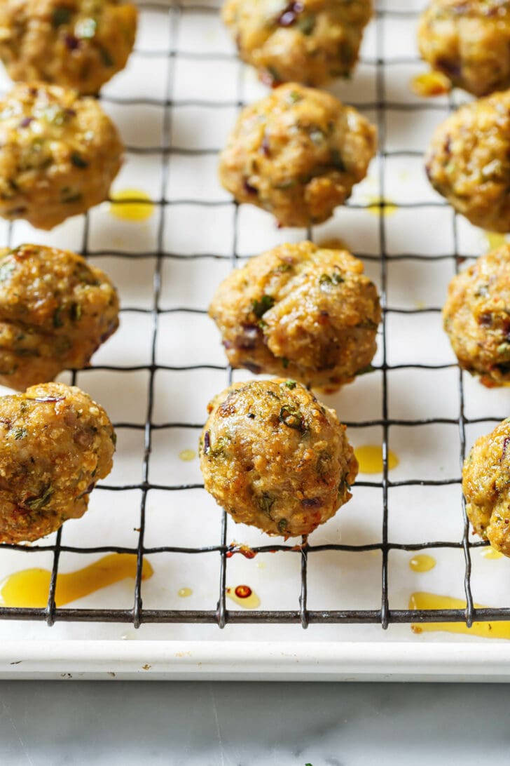 Baked Chicken Kofta on a rack on top of a parchment lined baking sheet.