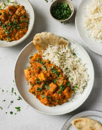 Matar Paneer in a plate with rice and naan.